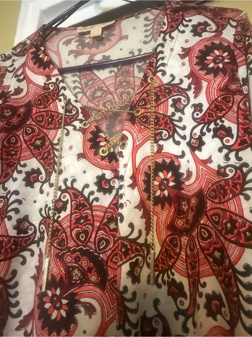 Red and Black Paisley Tunic with Gold Chain Detail.